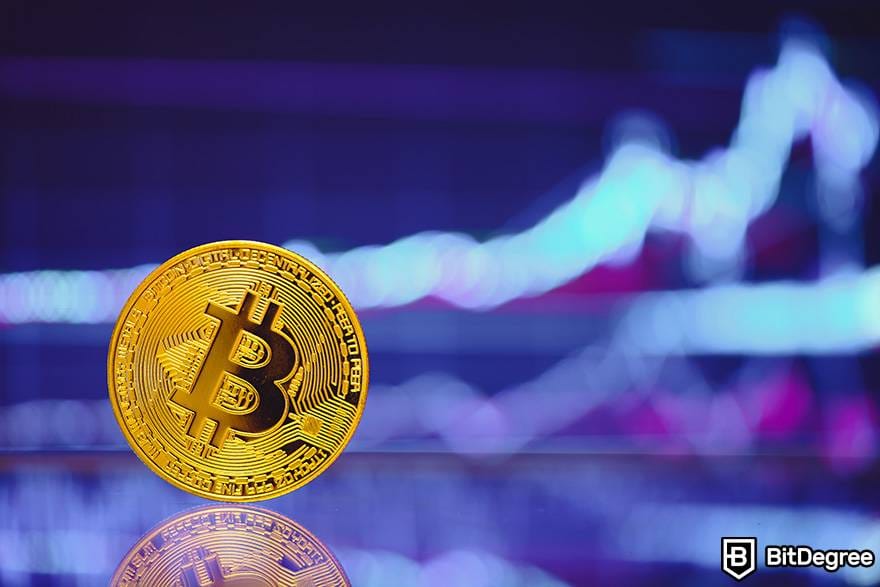 Margin Trading con Criptomonedas: una moneda Bitcoin física frente a una pantalla con información financiera borrosa. Margin Trading con Criptomonedas: una moneda Bitcoin física frente a una pantalla con información financiera borrosa.